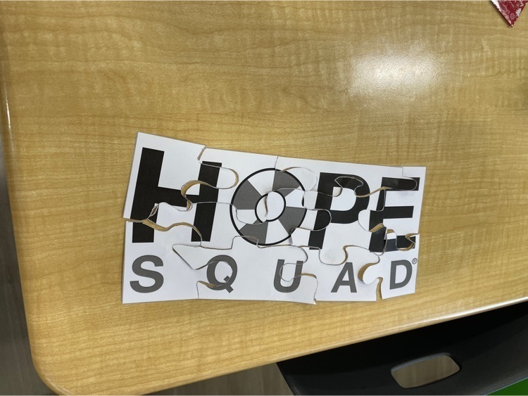 A jigsaw puzzle put together saying “Hope Squad"